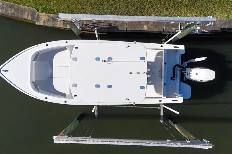Slide: The Image of Overhead view of a 2016 Albury Brothers 23 boat docked in calm water. - 26