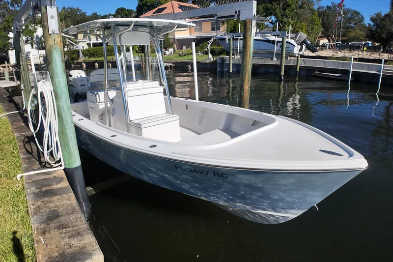 Slide: The Image of 2016 Albury Brothers 23 boat docked in a serene waterfront setting. - 4