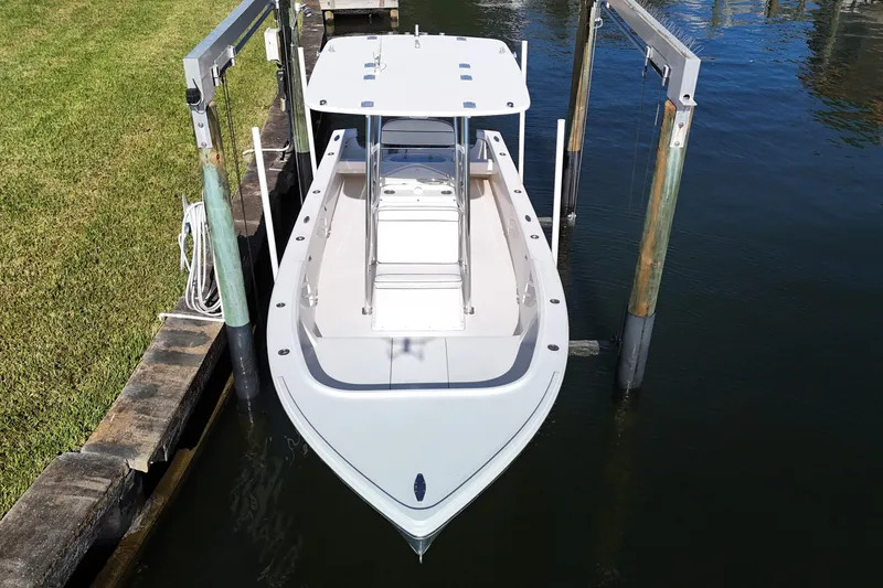Slide: The Image of 2016 Albury Brothers 23 boat docked on a lift, viewed from above. - 6