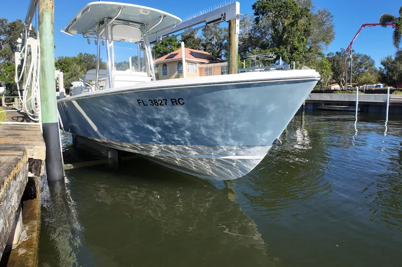 Slide: The Image of 2016 Albury Brothers 23 boat docked in sunny marina setting. - 8