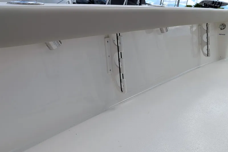 Slide: The Image of 2026 Key West 230 Bay Reef boat seat with gray and beige upholstery. - 12