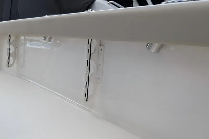 Slide: The Image of 2026 Key West 230 Bay Reef boat interior with seating and cooler. - 13