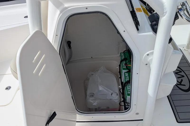Slide: The Image of Storage compartment of 2026 Key West 230 Bay Reef boat with portable toilet box. - 17