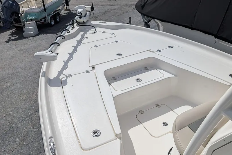 Slide: The Image of 2026 Key West 230 Bay Reef boat deck with storage compartments and trolling motor. - 19