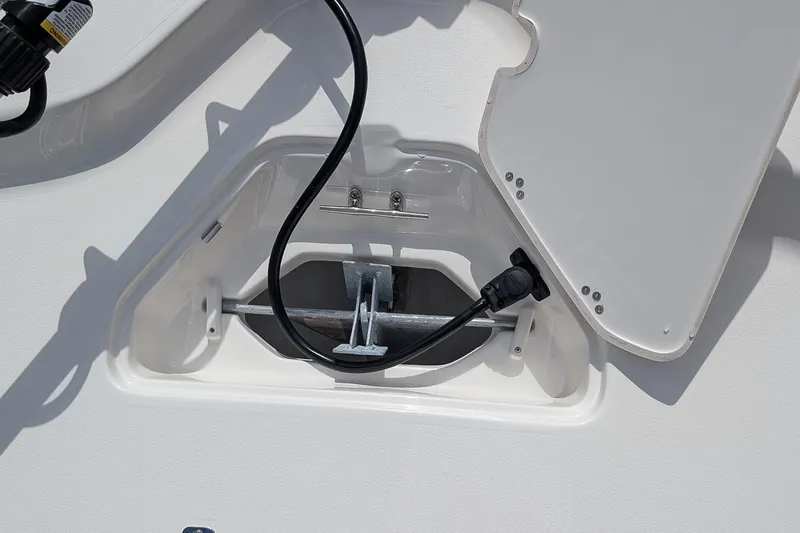 Slide: The Image of 2026 Key West 230 Bay Reef boat with trolling motor in dealership lot. - 21