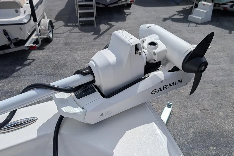 Slide: The Image of T-top of 2026 Key West 230 Bay Reef boat against clear blue sky. - 22