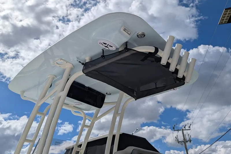 Slide: The Image of Manufacturer Provided Image: 2025 Key West 230 Bay Reef boat cruising on a calm waterway. - 24