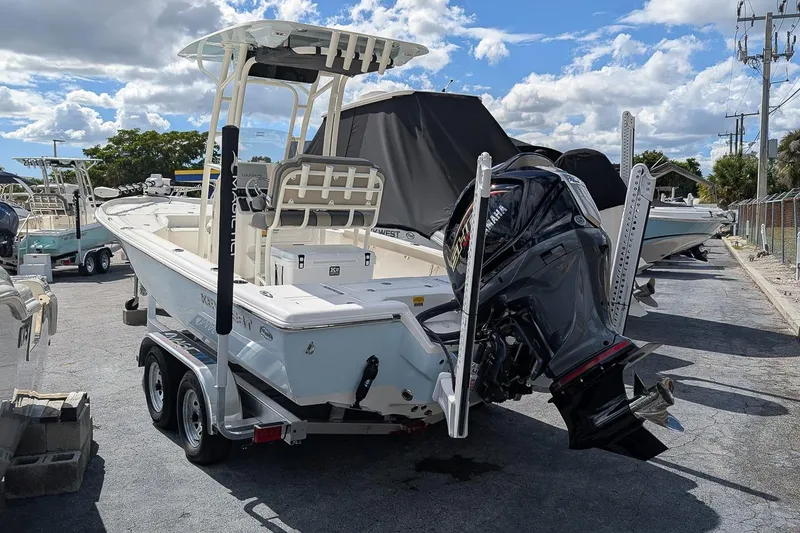 Slide: The Image of 2026 Key West 230 Bay Reef boat with Yamaha engine on trailer in marina. - 3