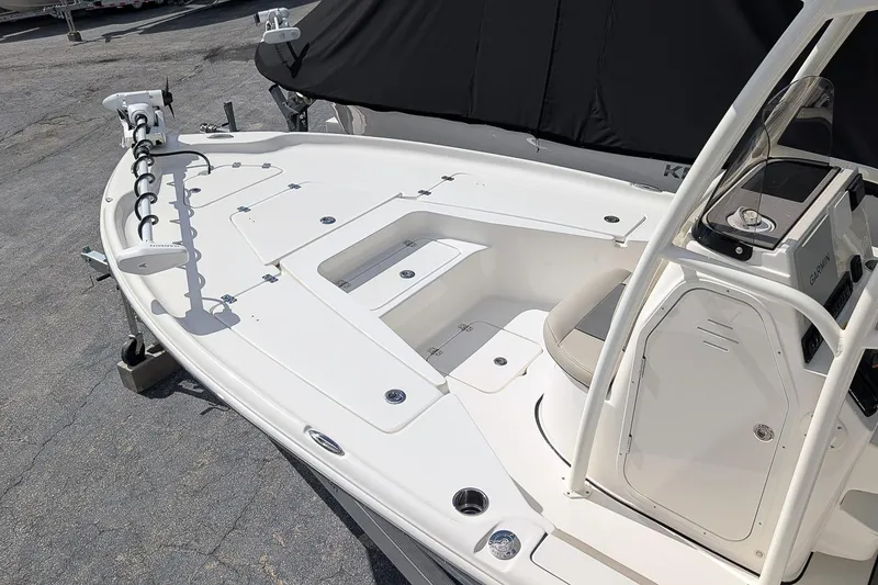 Slide: The Image of 2026 Key West 230 Bay Reef boat interior with seating and storage compartments. - 8