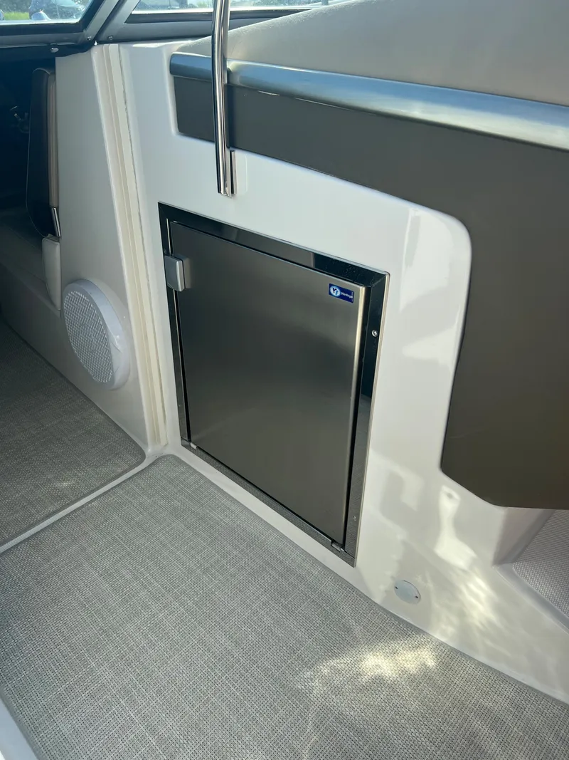 Slide: The Image of Stainless steel refrigerator on a 2013 Regal 3200 Bowrider boat. - 11