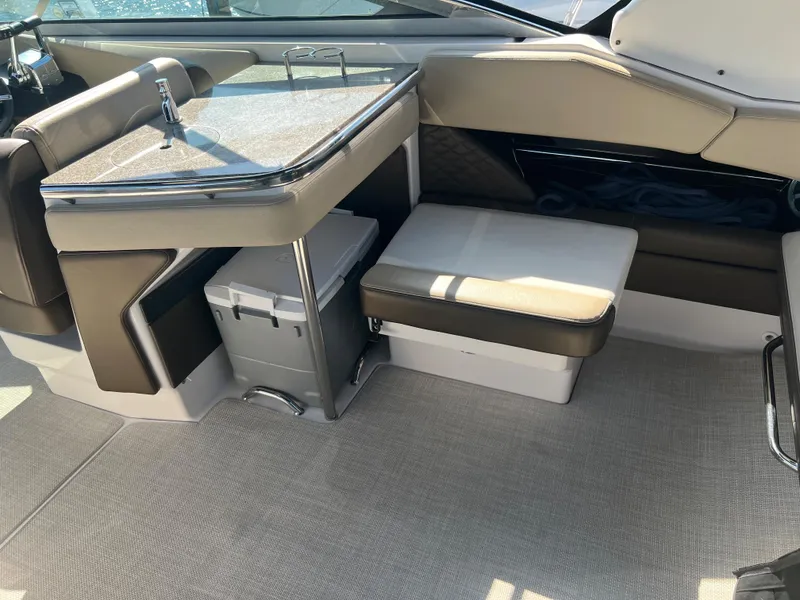 Slide: The Image of 2013 Regal 3200 Bowrider interior with seating and storage compartments. - 17