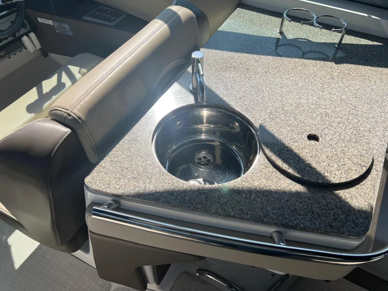 Slide: The Image of 2013 Regal 3200 Bowrider boat interior with sink and countertop. - 20
