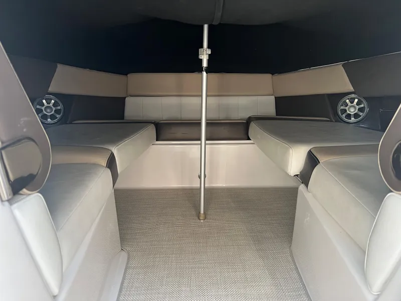 Slide: The Image of Interior seating area of 2013 Regal 3200 Bowrider boat with cushioned seats. - 22