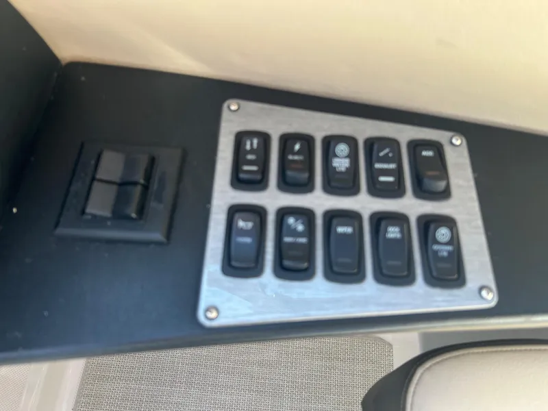 Slide: The Image of Control panel of a 2013 Regal 3200 Bowrider boat. - 23