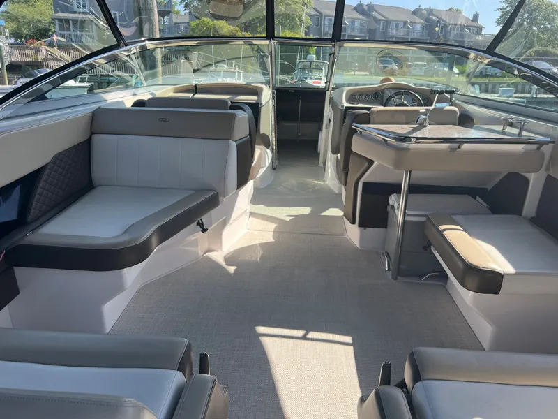 Slide: The Image of 2013 Regal 3200 Bowrider interior with spacious seating and modern design. - 5