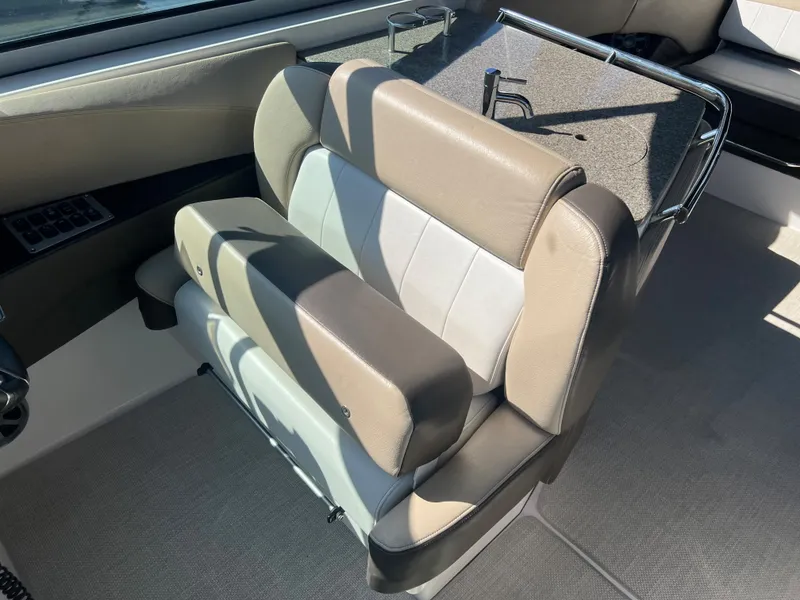 Slide: The Image of 2013 Regal 3200 Bowrider boat interior seating and helm station. - 9