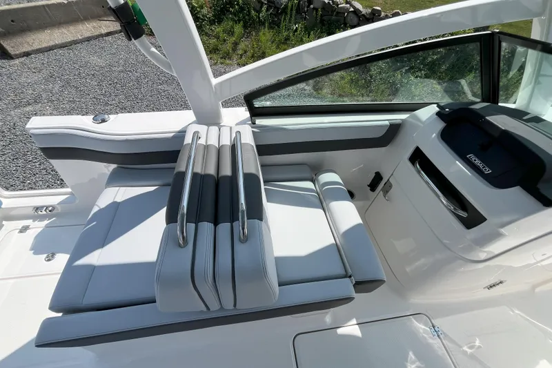 Slide: The Image of 2026 Robalo R257 Dual Console boat interior with sleek seating and modern dashboard design. - 12