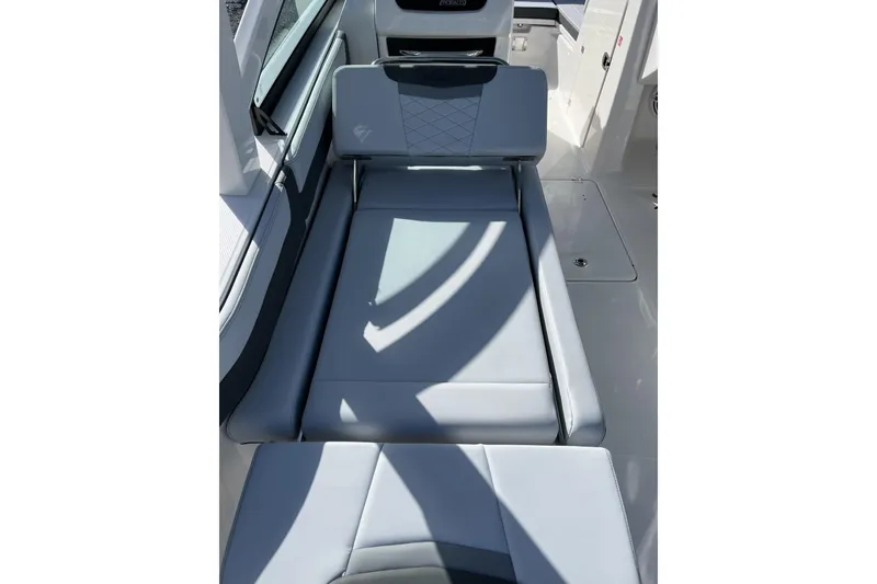 Slide: The Image of 2026 Robalo R257 Dual Console boat interior with sleek, modern seating design. - 13