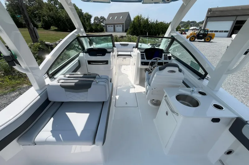 Slide: The Image of 2026 Robalo R257 Dual Console boat interior with seating, helm, and sink. - 6