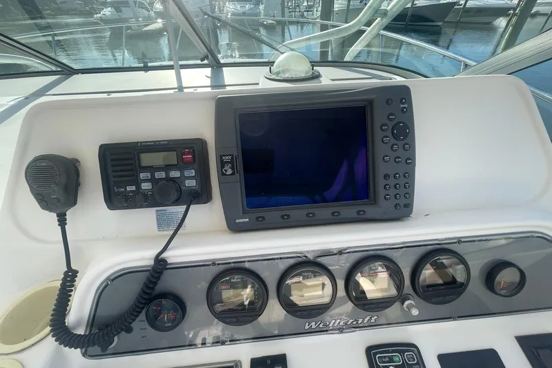 Slide: The Image of Control panel of a 2005 Wellcraft 290 Coastal boat with navigation equipment. - 34