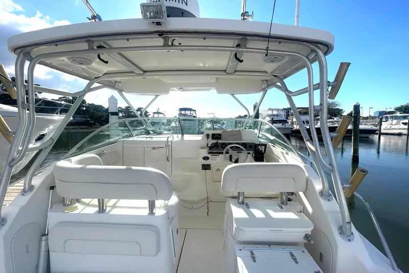 Slide: The Image of 2005 Wellcraft 290 Coastal boat interior with helm, docked at marina. - 36