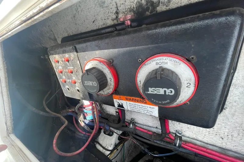 Slide: The Image of Electrical panel of a 2005 Wellcraft 290 Coastal boat with wiring and switches. - 41