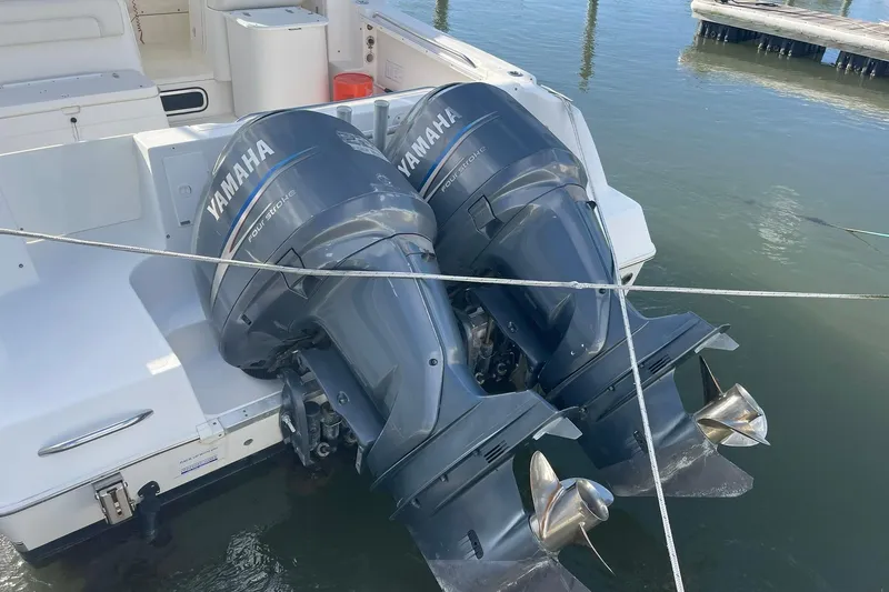 Slide: The Image of 2005 Wellcraft 290 Coastal boat with twin Yamaha outboard engines docked. - 45