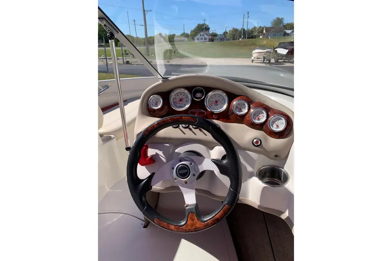 Slide: The Image of 2014 Tahoe Q5i Sport dashboard with steering wheel and gauges in sunlight. - 6