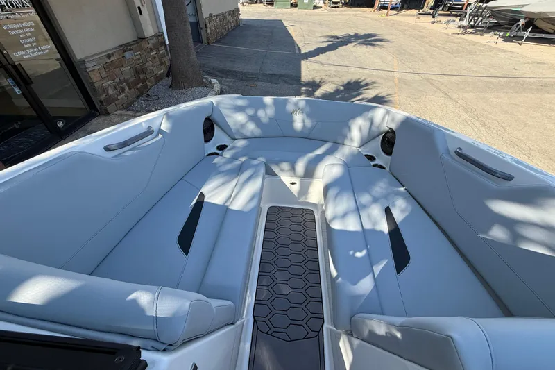 Slide: The Image of 2023 MasterCraft NXT24 boat interior with sleek seating and modern design. - 13