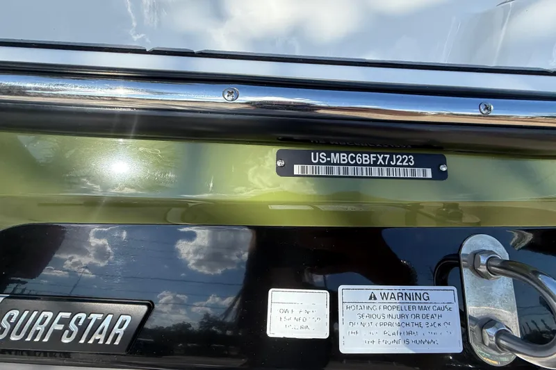 Slide: The Image of 2023 MasterCraft NXT24 boat with identification plate and warning label. - 18