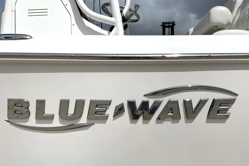Slide: The Image of 2019 Blue Wave 2800 Pure Hybrid boat logo on white surface. - 19