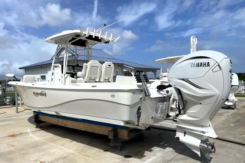 Slide: The Image of 2019 Blue Wave 2800 Pure Hybrid boat with Yamaha engine on display. - 2