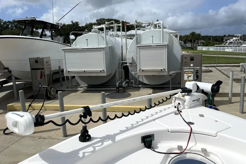 Slide: The Image of 2019 Blue Wave 2800 Pure Hybrid boat at a marina fuel station. - 23