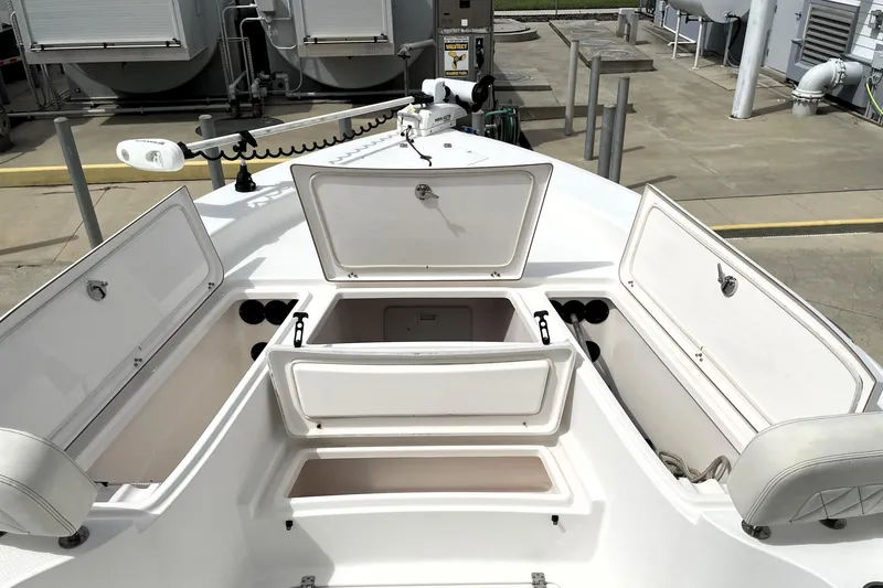 Slide: The Image of 2019 Blue Wave 2800 Pure Hybrid boat with open storage compartments. - 32