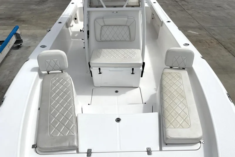 Slide: The Image of 2019 Blue Wave 2800 Pure Hybrid boat interior with white cushioned seating and spacious layout. - 33
