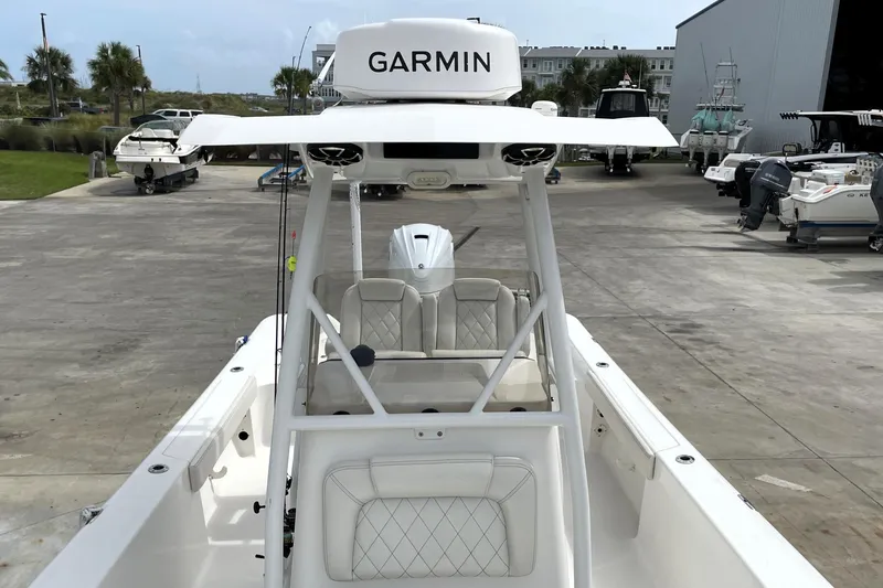 Slide: The Image of 2019 Blue Wave 2800 Pure Hybrid boat with Garmin equipment at a marina. - 34