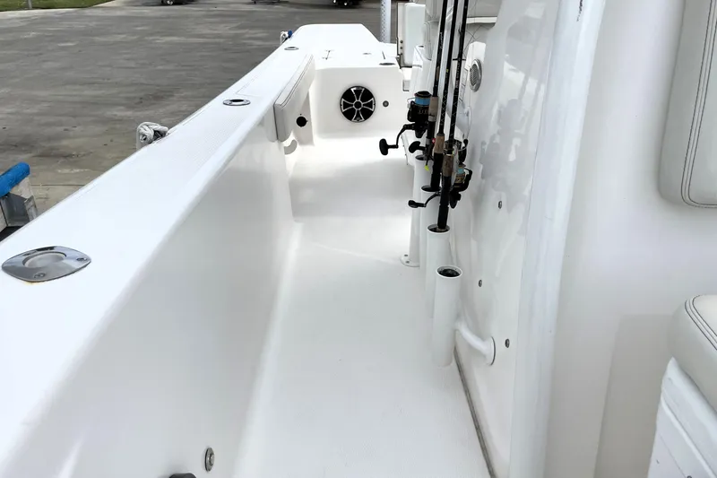 Slide: The Image of 2019 Blue Wave 2800 Pure Hybrid boat interior with fishing rod holders. - 37