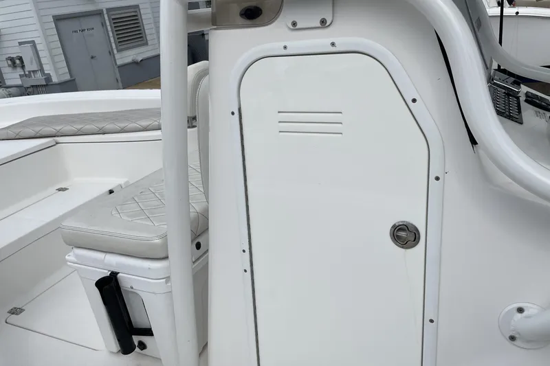 Slide: The Image of 2019 Blue Wave 2800 Pure Hybrid boat interior with white seating and storage compartment. - 39