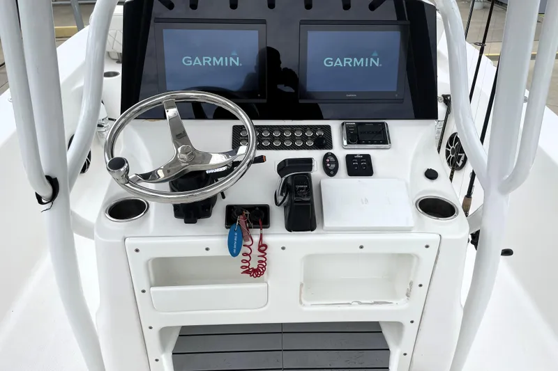Slide: The Image of Control panel of 2019 Blue Wave 2800 Pure Hybrid boat with Garmin displays. - 46