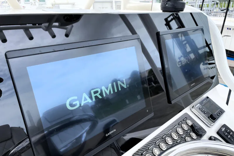 Slide: The Image of Garmin displays on 2019 Blue Wave 2800 Pure Hybrid boat dashboard. - 47