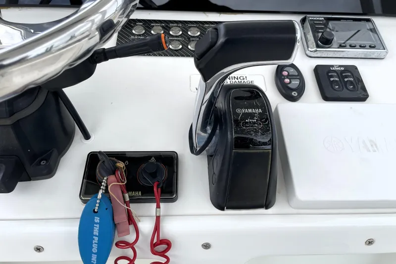 Slide: The Image of Control panel of a 2019 Blue Wave 2800 Pure Hybrid boat with Yamaha throttle. - 49