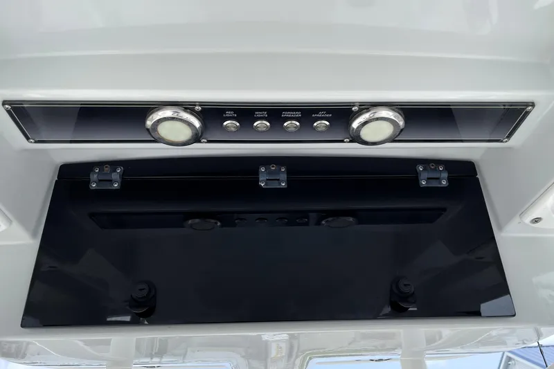 Slide: The Image of 2019 Blue Wave 2800 Pure Hybrid boat control panel with light switches and indicators. - 50