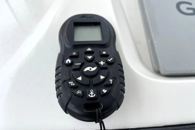 Slide: The Image of Remote control for Blue Wave 2800 Pure Hybrid boat, 2019 model, on white surface. - 52