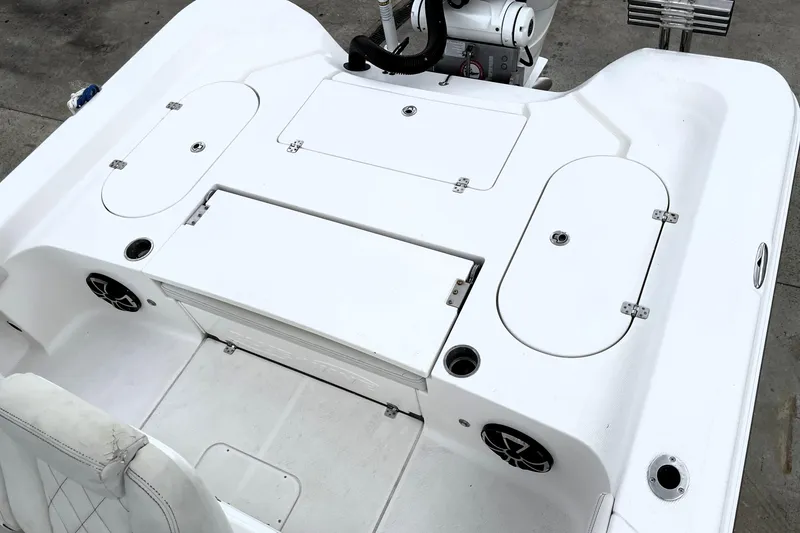 Slide: The Image of 2019 Blue Wave 2800 Pure Hybrid boat deck with storage compartments and seating. - 53