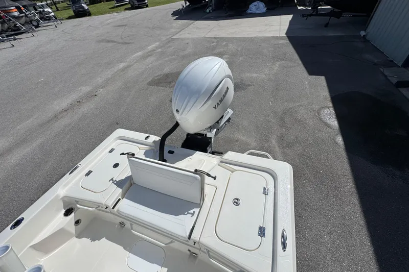 Slide: The Image of 2026 Skeeter SX221 boat with Yamaha outboard motor, parked on pavement. - 12