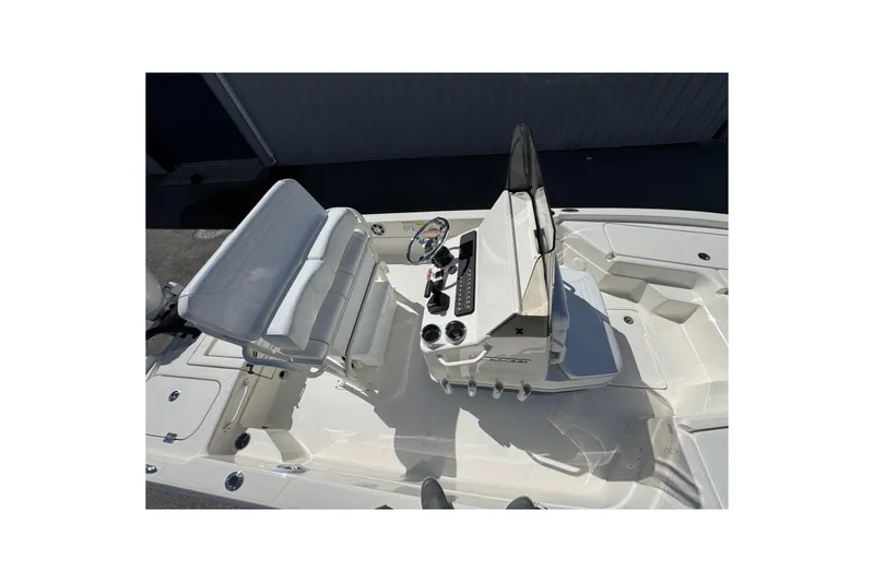 Slide: The Image of 2026 Skeeter SX221 boat interior with steering console and seating area. - 18