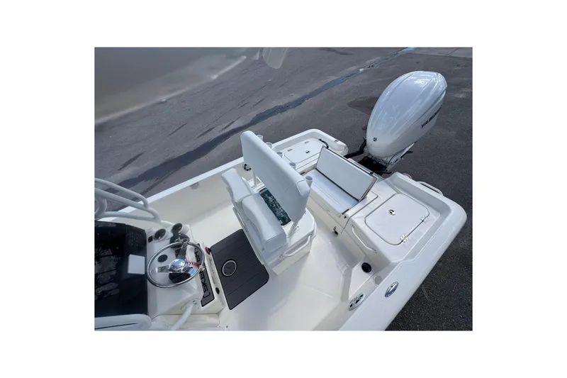 Slide: The Image of 2026 Skeeter SX221 boat interior with seating and outboard motor. - 20