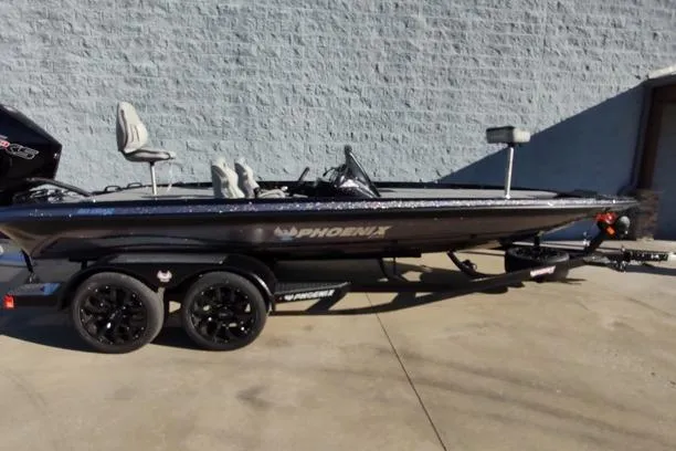 The Image of 2026 Phoenix 921 Elite X boat on trailer, parked outdoors. - 1