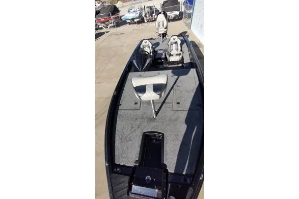 Slide: The Image of 2026 Phoenix 921 Elite X boat with dual seats and spacious deck. - 4