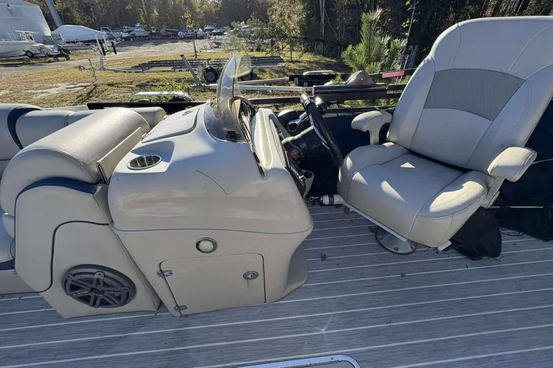 Slide: The Image of 2017 Berkshire 23 boat interior with steering console and seating. - 12